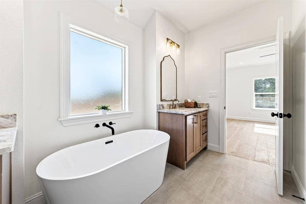 Stand alone tub in the primary en-suite. Great for morning routines or a nightly wind down.