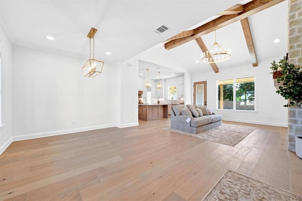 Entering the home, a warm welcome is offered by the dedicated dining space or seating area with ample room for a large table or extra seating perfect for hosting holiday gatherings or simply an extra space to spend out.