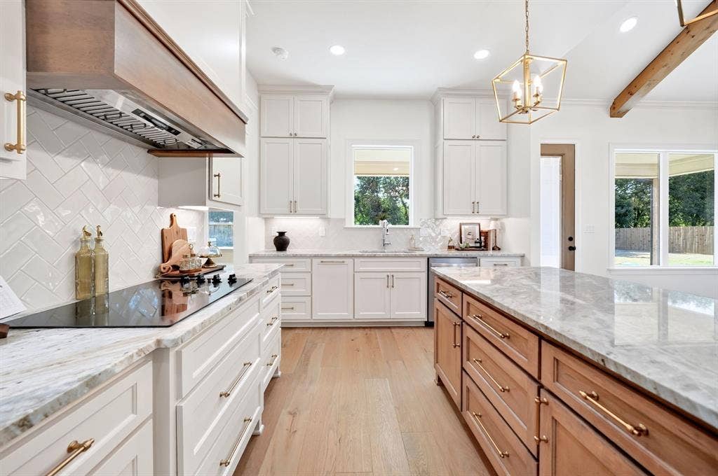 Light wood-finish flooring complements white walls with matching baseboards