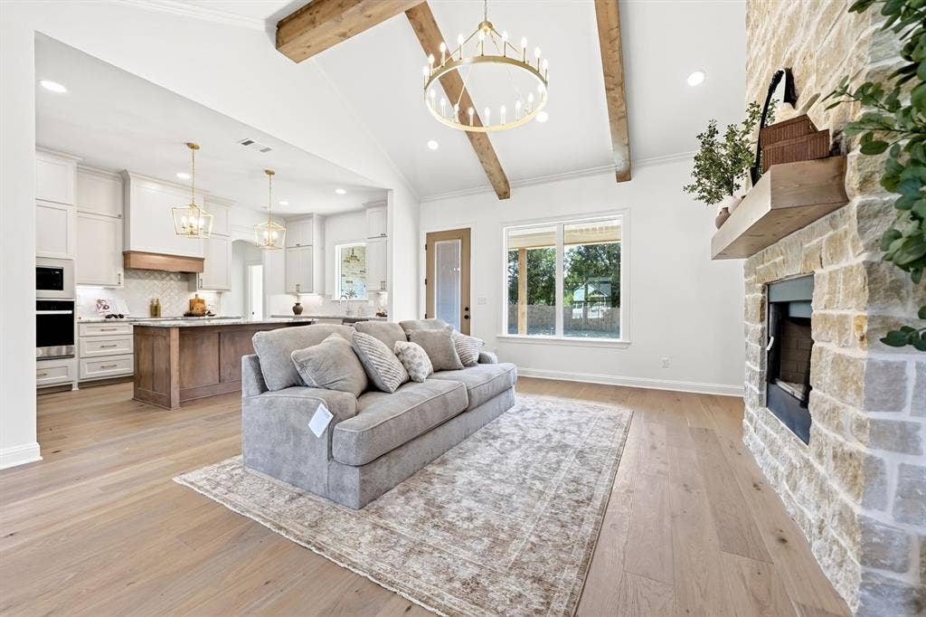 As you step further into your new home, the vaulted ceilings & stone fireplace create a welcoming atmosphere for you & your guests alike. The stone fireplace will be a conversation piece for years to come.