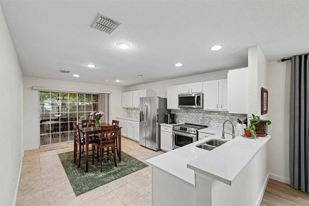3123 Melrose Drive, McKinney, TX 75070 Huge kitchen with quartz counters, stainless appliances, double sink