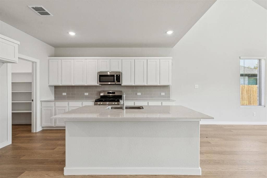 2120 Sunshining Road, Princeton, TX 75407 Kitchen in the Winters home plan by Trophy Signature Homes – REPRESENTATIVE PHOTO