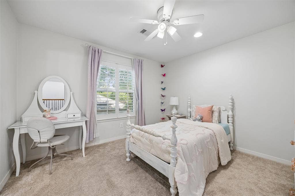 4110 Shady Hill Drive, Dallas, TX 75229 A bright upstairs bedroom offers generous space, soft natural light, and access to the adjoining Jack-and-Jill bath.