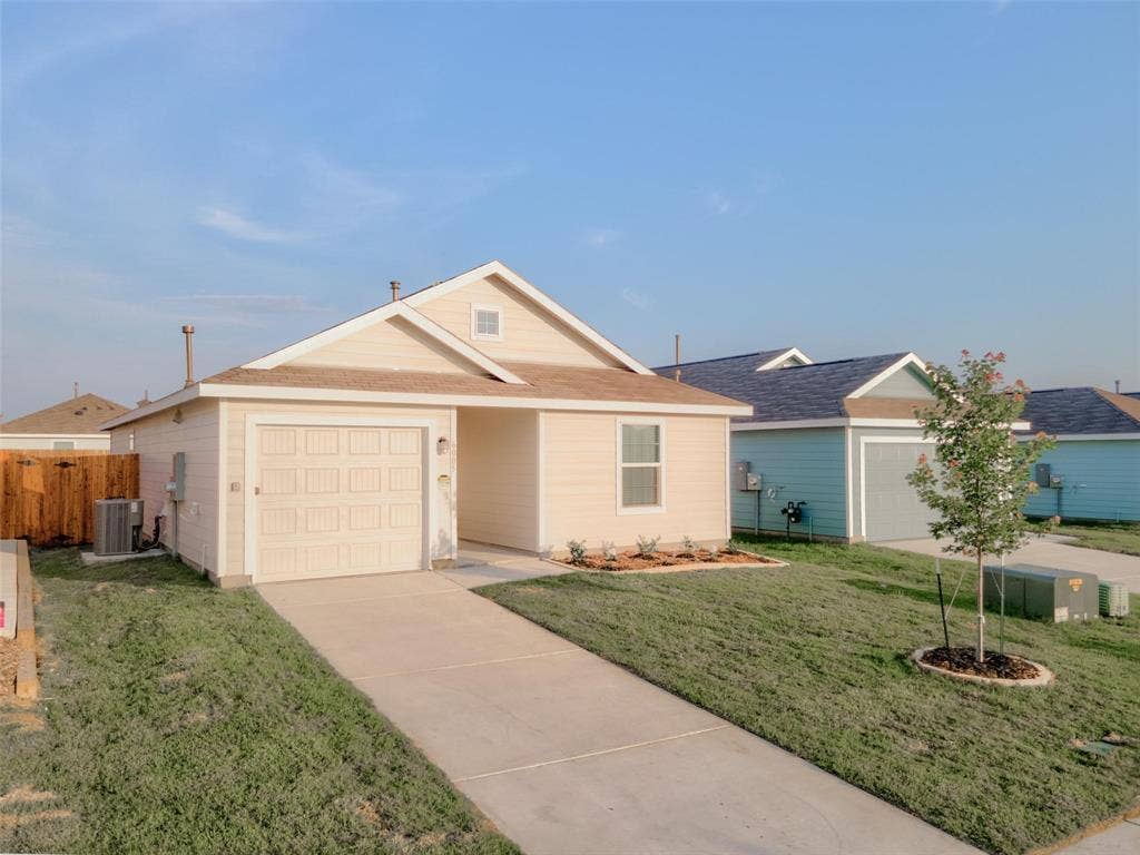 6005 Determine Lane, Forney, TX 75126 Single-story residence featuring light-colored siding and a contrasting roof