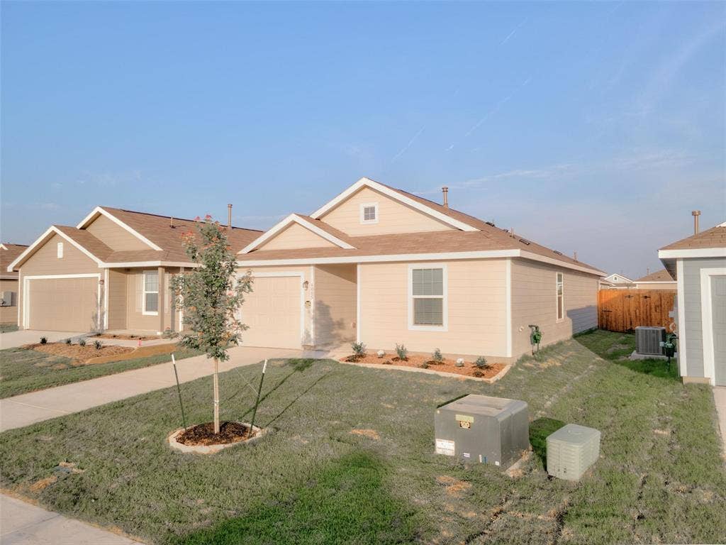 6005 Determine Lane, Forney, TX 75126 Single-story residence featuring a neutral-toned exterior and a brown shingle roof