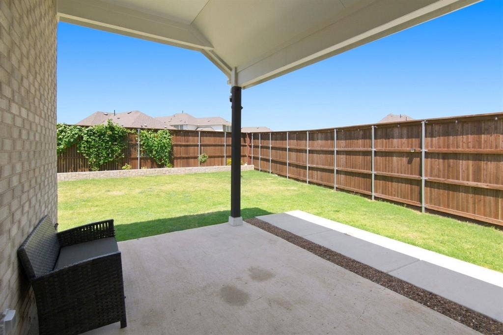 944 Tara Court, Haslet, TX 76052 Covered concrete patio with a single support pillar