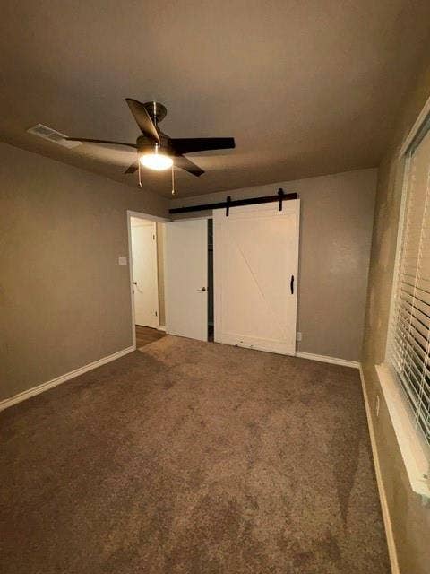 Secondary bedroom with barn door.