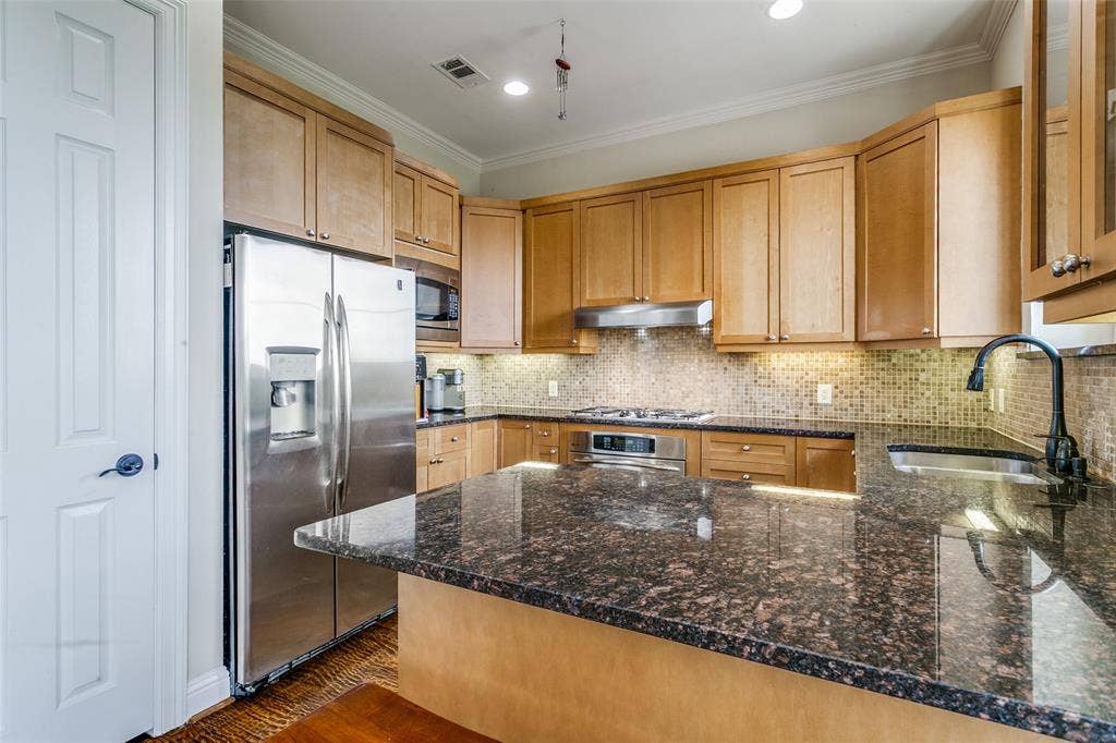 Modern kitchen featuring refreshed finishes, ample storage, and a functional layout designed for everyday cooking.