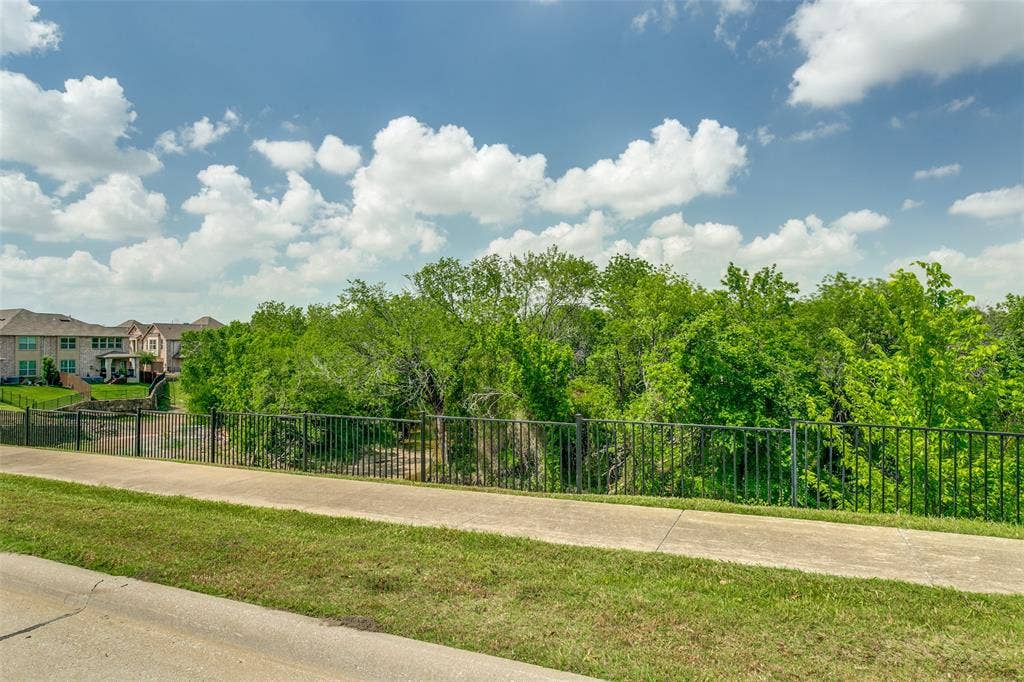 Front facing views of the nearby green space provide a beautiful backdrop and sense of openness.