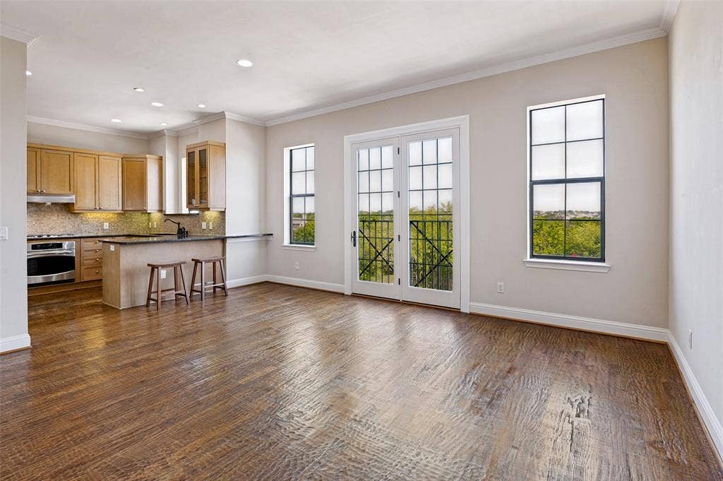 Charming Juliet balcony adds a distinctive architectural touch to the dining room.