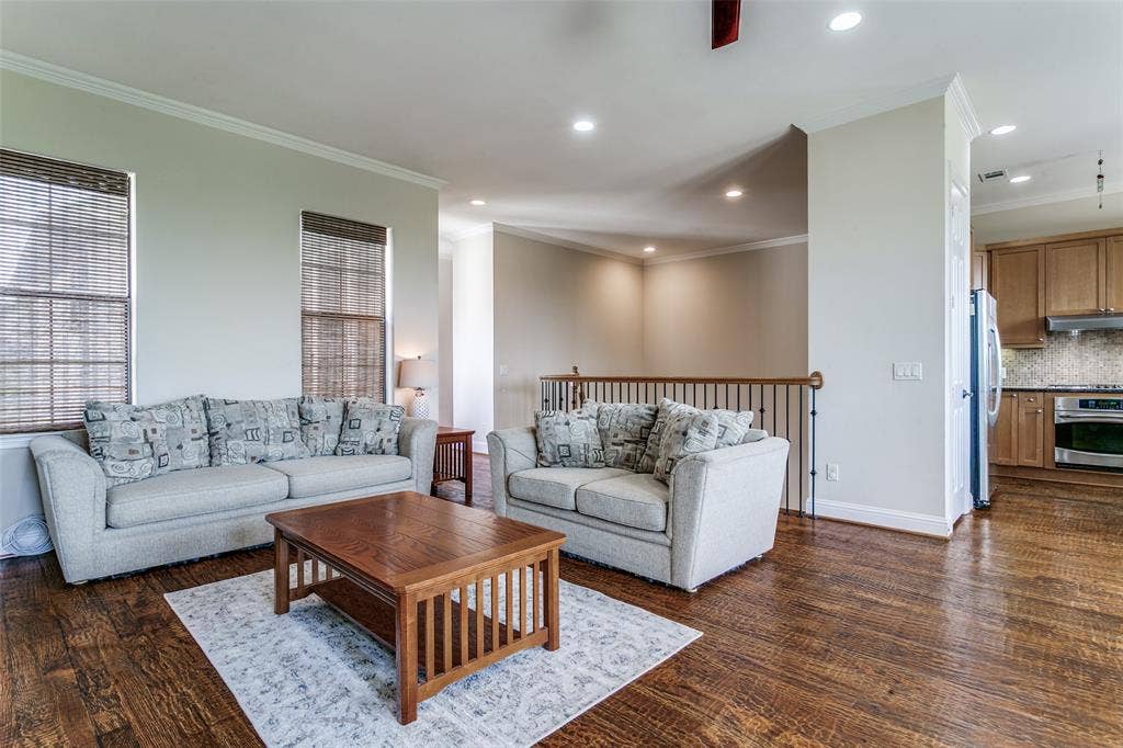Open living space that flows seamlessly into the dining area and kitchen, creating an inviting setting for everyday living and entertaining.
