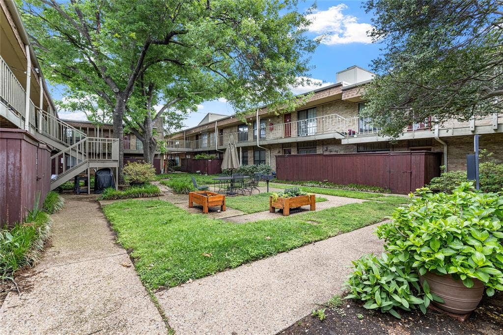 5916 Birchbrook Drive, #129, Dallas, TX 75206 Central courtyard with a manicured lawn and mature trees