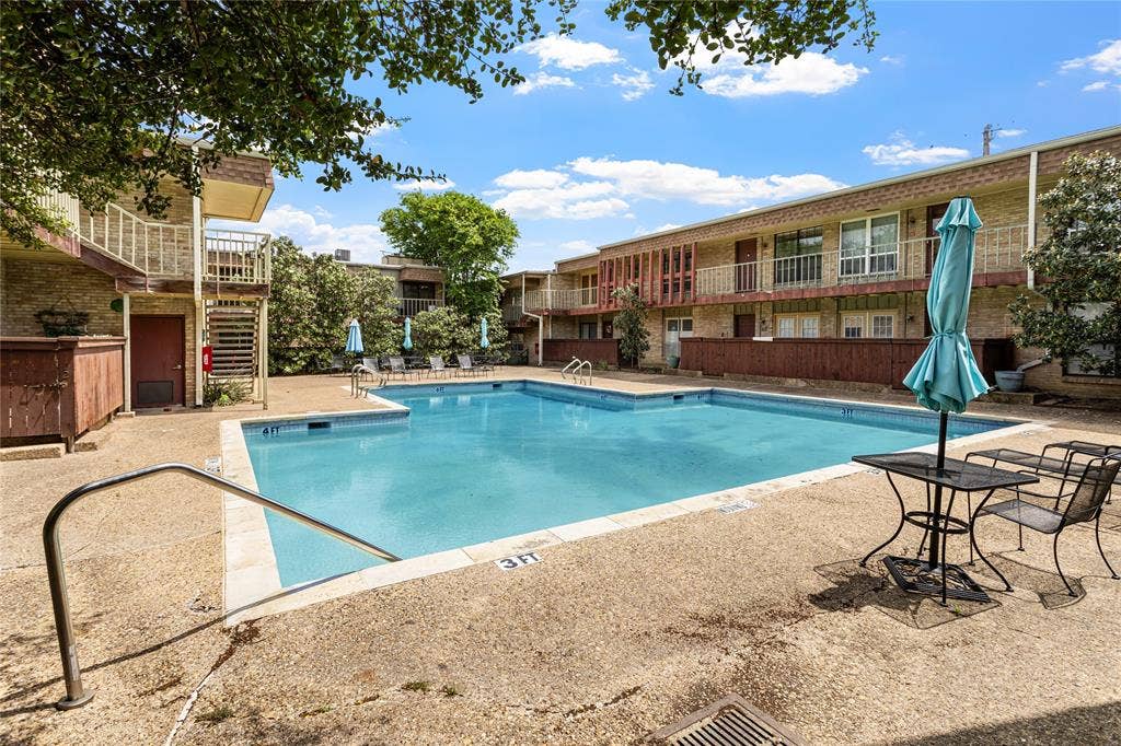 5916 Birchbrook Drive, #129, Dallas, TX 75206 Central courtyard featuring a rectangular pool with perimeter decking