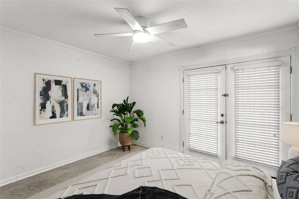 5916 Birchbrook Drive, #129, Dallas, TX 75206 Virtually Staged Bedroom w/ Double French doors with privacy blinds