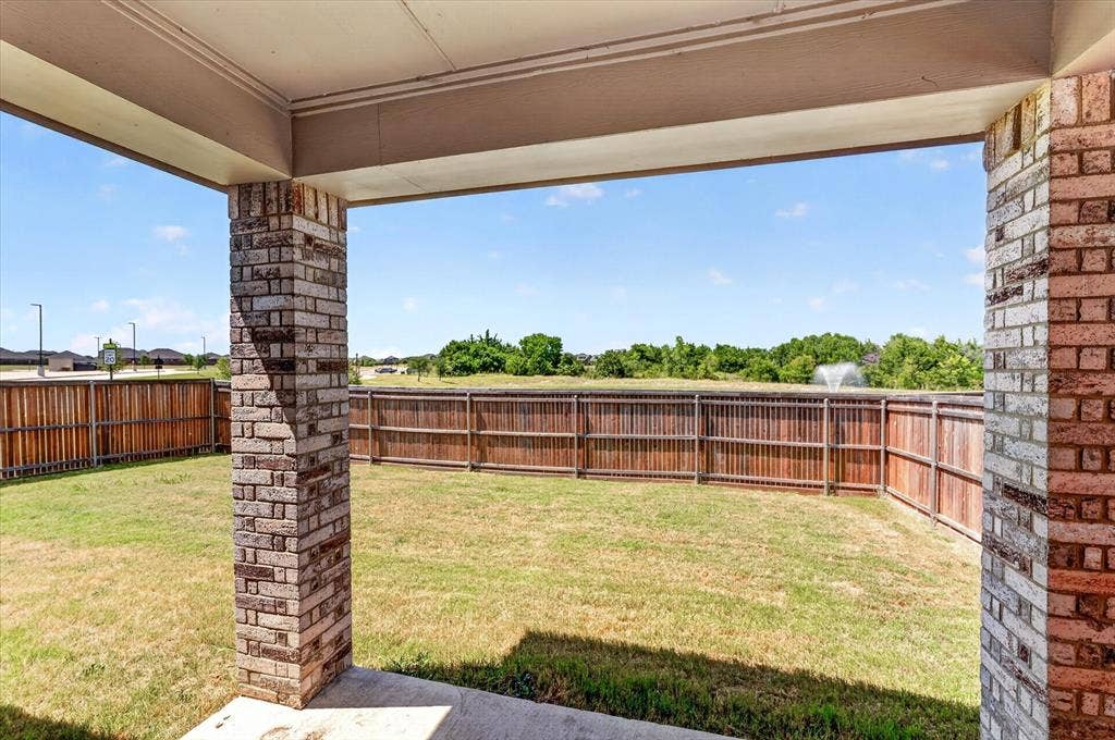 2832 Lolita Way, Forney, TX 75126 Covered patio featuring brick columns and a concrete slab