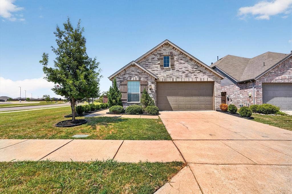 2832 Lolita Way, Forney, TX 75126 Stone and brick facade with a two-car garage