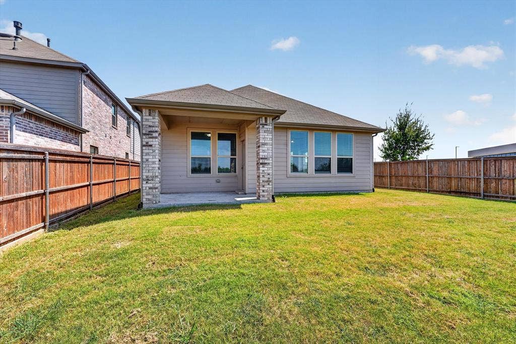 2832 Lolita Way, Forney, TX 75126 Modern single-story residence featuring a brick and stone exterior with contemporary architectural lines