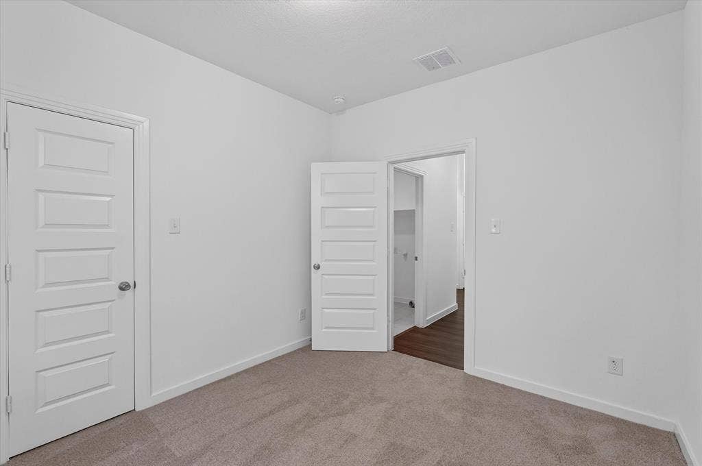 2832 Lolita Way, Forney, TX 75126 Neutral wall tones with plush carpeting complement the modern five-panel interior doors