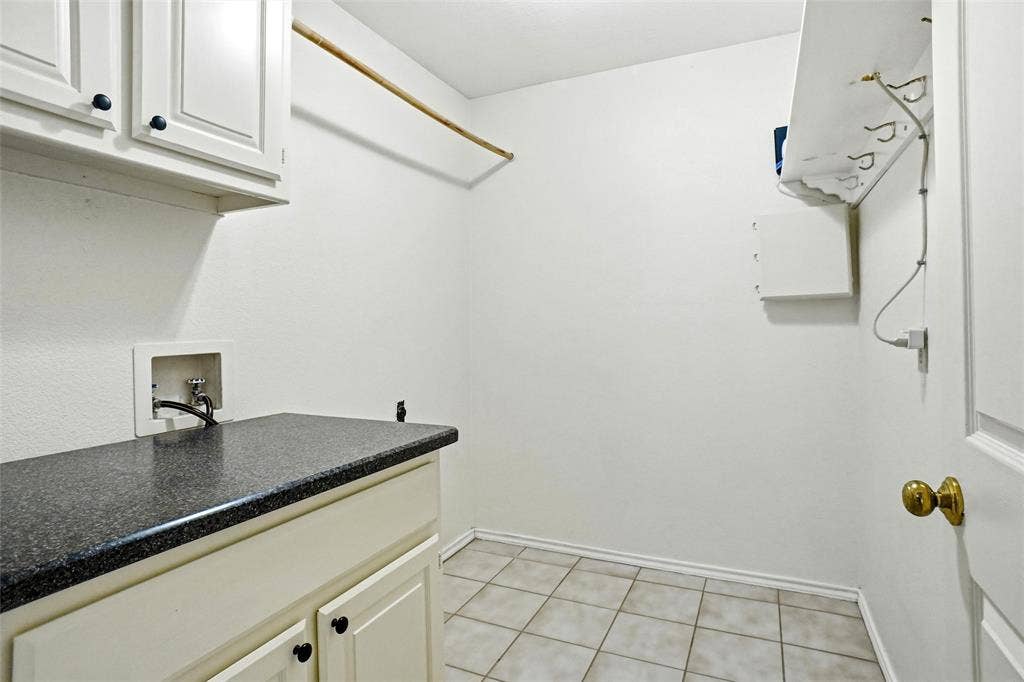 1321 Oak Harbor Boulevard, Azle, TX 76020 Spacious laundry room with storage and hanging areas!
