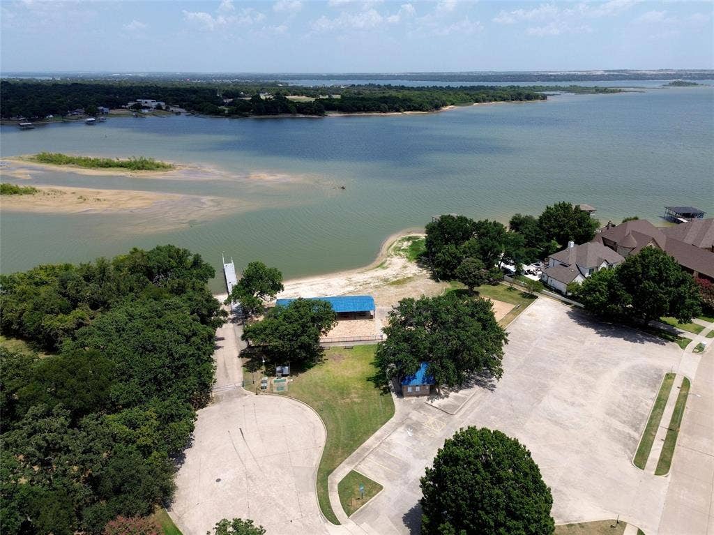 1321 Oak Harbor Boulevard, Azle, TX 76020 Just a short walk to the Community Park with playground, boat launch and volleyball courts!