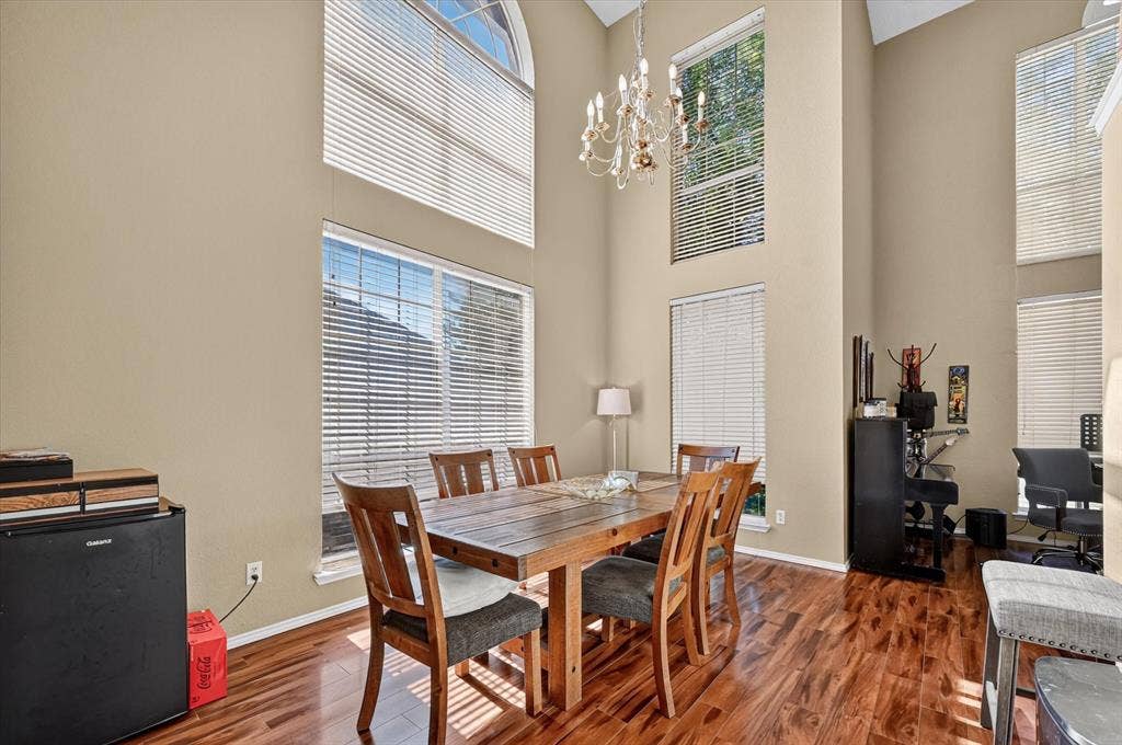 1625 Falmouth Drive, Plano, TX 75025 Expansive room featuring high ceilings and wood-finish flooring
