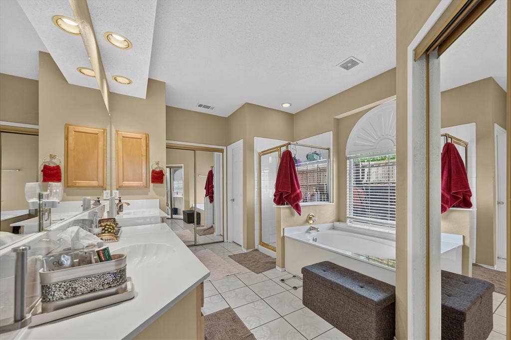 1625 Falmouth Drive, Plano, TX 75025 Dual vanity with white countertops, integrated sinks, and overhead recessed lighting