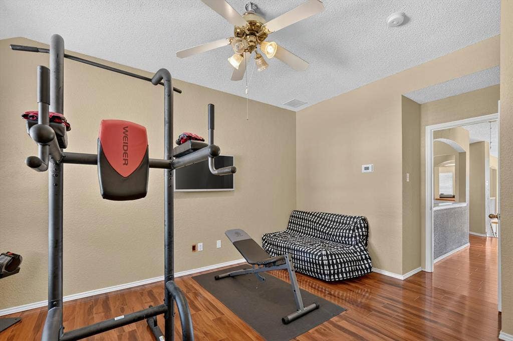 1625 Falmouth Drive, Plano, TX 75025 Versatile room featuring wood-finish flooring and neutral wall tones