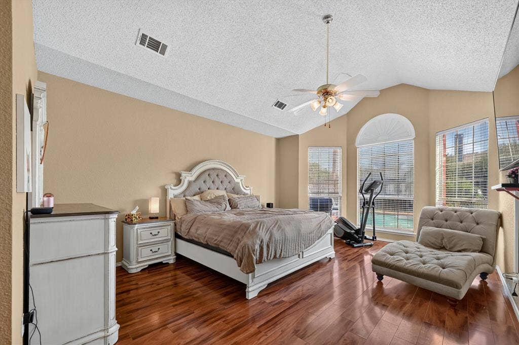 1625 Falmouth Drive, Plano, TX 75025 Vaulted ceiling bedroom featuring wood-finish flooring