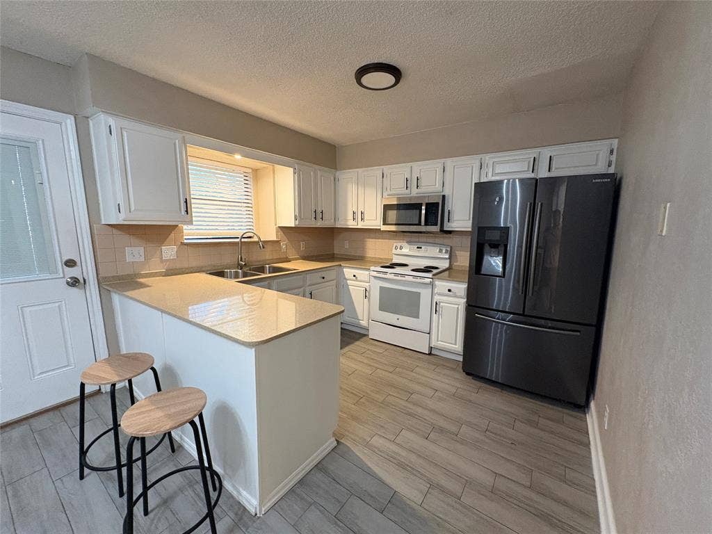 Granite countertop and fridge included