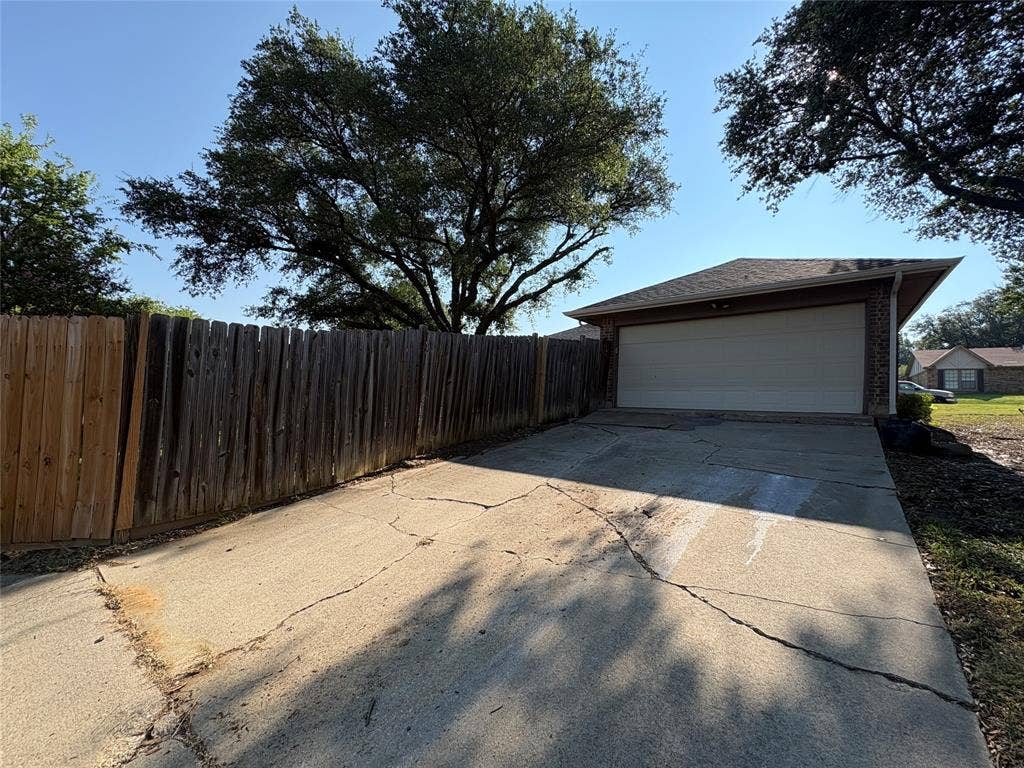 two car garage and extra driveway parking from the alley