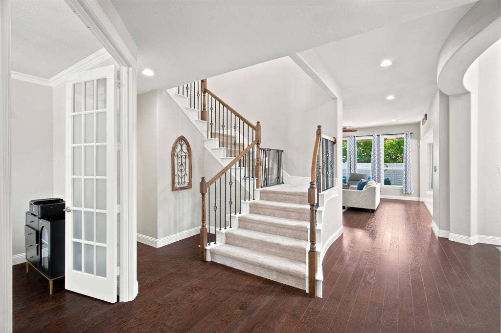 Grand entrance space and rich wood flooring