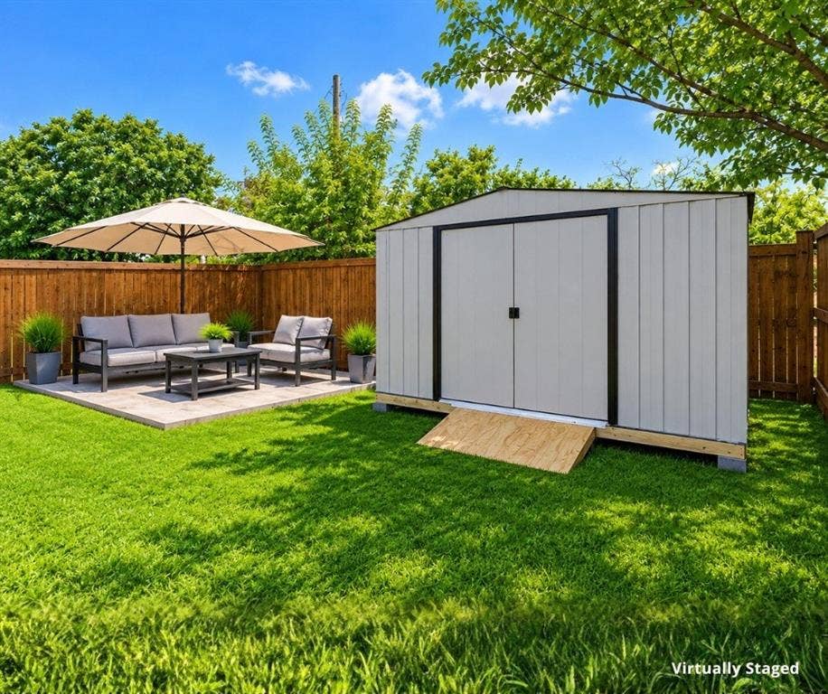 305 N Arizona Drive, #307, Celina, TX 75009 Virtually staged to showcase the outdoor living potential. Concrete patio pad and storage shed are included.