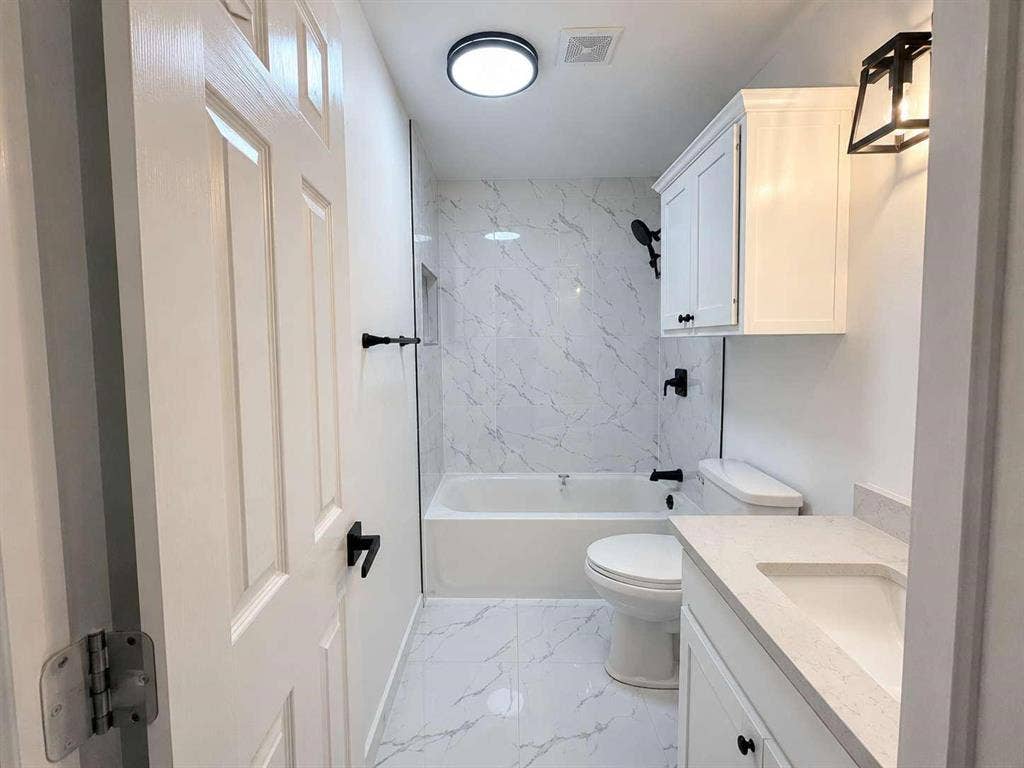 305 N Arizona Drive, #307, Celina, TX 75009 Bathroom featuring a white vanity with an integrated sink and light-colored countertop