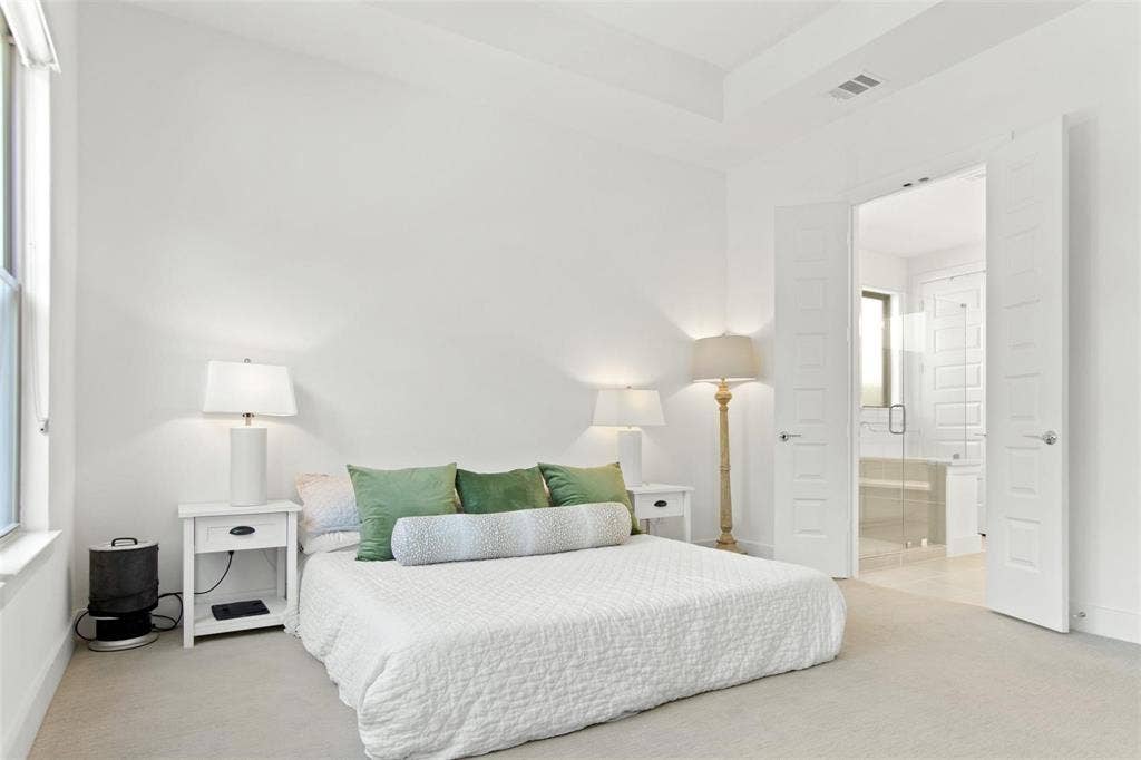 7867 Verona Place, Dallas, TX 75231 Spacious room with light-colored carpet flooring, high ceilings, and a large window
