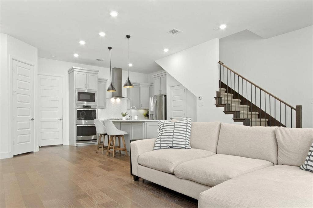 7867 Verona Place, Dallas, TX 75231 Open-concept living space with wood-finish flooring