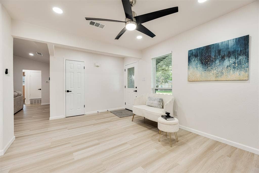 Bright interior space featuring light wood-finish flooring