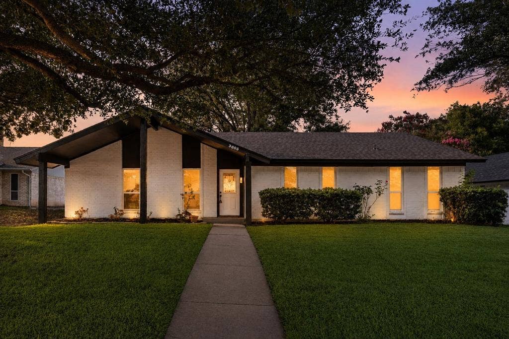 White painted brick exterior with black trim details