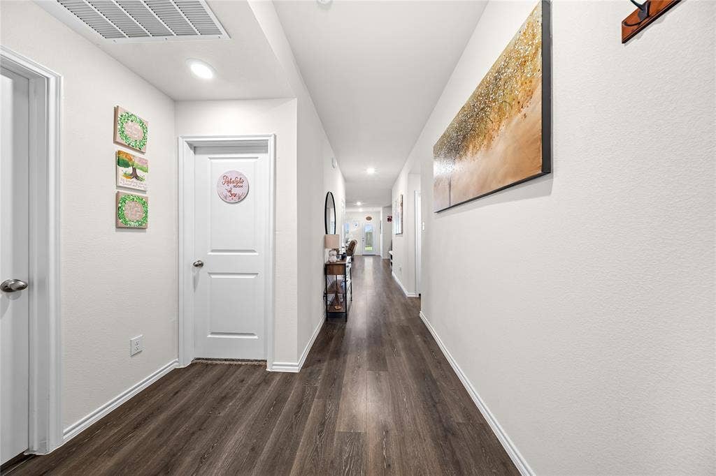2920 Roper Street, Royse City, TX 75189 Hallway featuring wood-finish flooring, recessed lighting, white walls, white trim, and white paneled doors