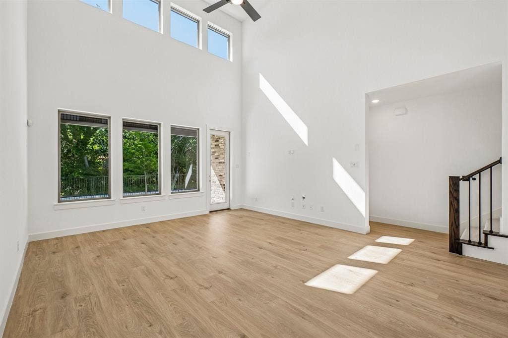 1516 Rose Mallow Road, Celina, TX 75009 With a wall of dual stacked windows, the spacious family room is filled with natural light and offers a beautiful view of the greenbelt the backs to the home.