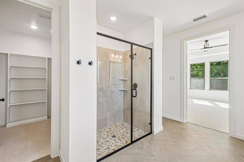1516 Rose Mallow Road, Celina, TX 75009 Featuring a spacious walk in shower plus his and her closets, this dream owner's bath is one for the ages!
