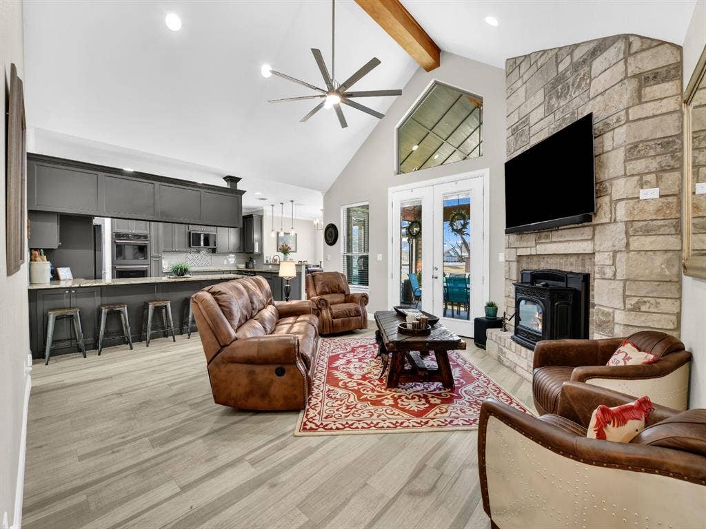 5418 Wedgefield Road, Granbury, TX 76049 Living room with beam and fireplace