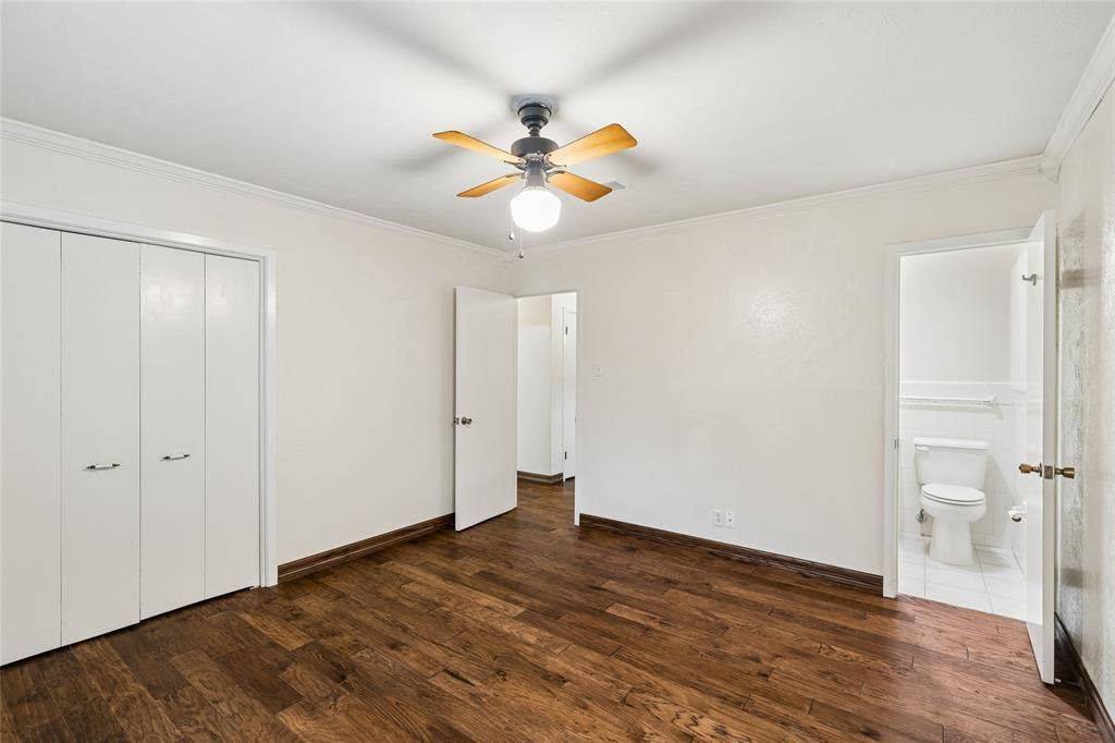 505 Caduceus Lane, Hurst, TX 76053 Primary bedroom is located at the end of the hallway with an attached bath