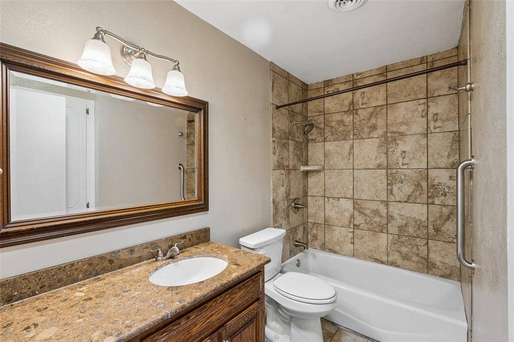 505 Caduceus Lane, Hurst, TX 76053 Hallway bath serves the additional bedrooms. Notice the different textures here, all complimenting each other. Shower over tub makes this a great combination for family members of all ages.