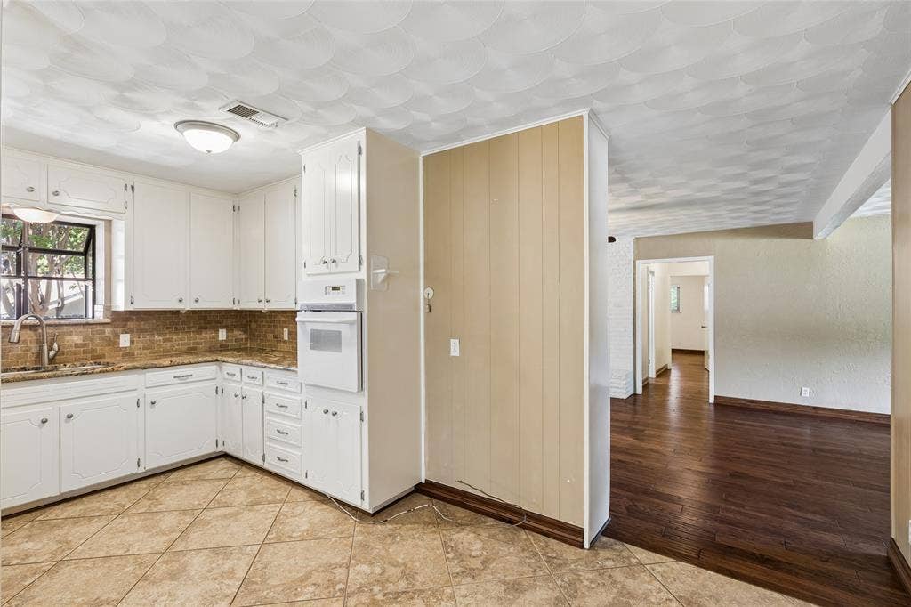 505 Caduceus Lane, Hurst, TX 76053 The warm rich real wood floors greet you as you walk from the kitchen area into the formal living area