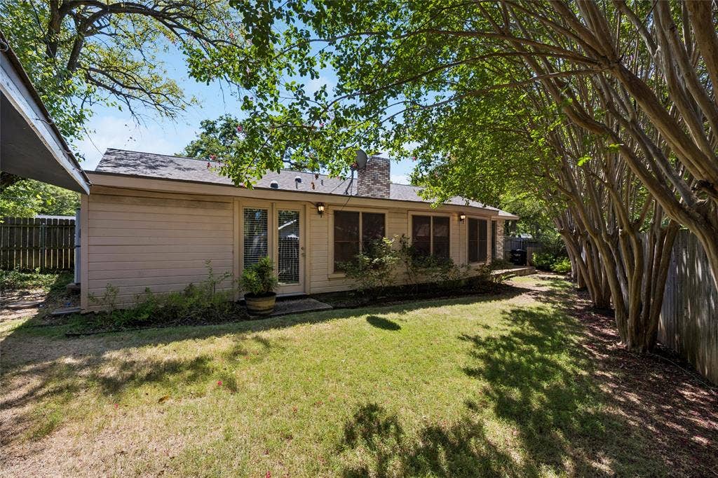 505 Caduceus Lane, Hurst, TX 76053 Mature trees in backyard offer plenty of shade on sunny afternoons.