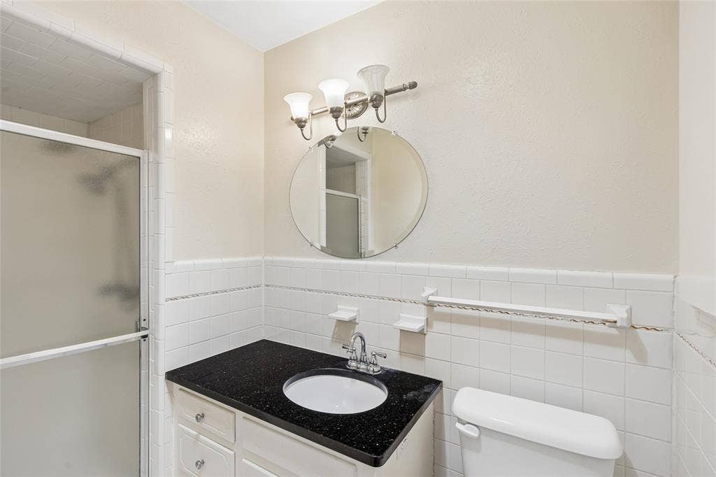 505 Caduceus Lane, Hurst, TX 76053 Beautiful dark granite and crisp white tile back wall give endless possibilities for decorating. Newer hardware, mirror and light fixtures add smooth texture appeal.