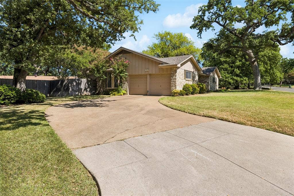 505 Caduceus Lane, Hurst, TX 76053 Sloped driveway provides ample parking for 4 vehicles