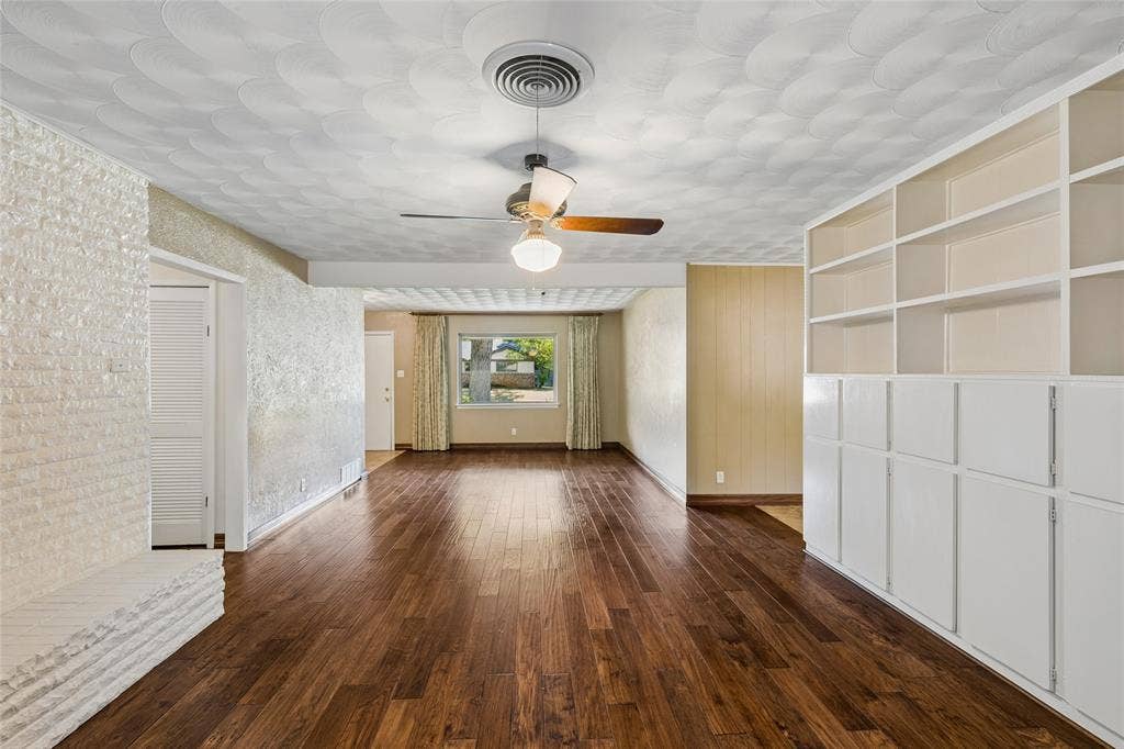 505 Caduceus Lane, Hurst, TX 76053 Wood floors continue through the living room into the spacious family room