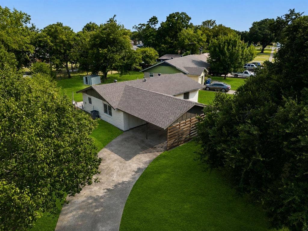2251 Hartline Drive, Dallas, TX 75228 From above, this beautifully updated home showcases its impressive footprint on a generously sized lot surrounded by mature trees and established landscaping