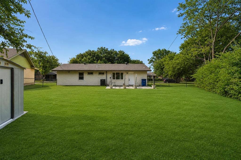 2251 Hartline Drive, Dallas, TX 75228 Step outside and discover a spacious backyard designed for both relaxation and entertaining. The outdoor setting with plenty of room for children to play, pets to roam, or future additions such a pool, garden, or outdoor living area. Mature trees surrounding the property, while the expansive open space offers endless possibilities for weekend gatherings, backyard games, and peaceful evenings under the Texas sky. Completing the space is a convenient storage shed, perfect for organizing lawn equipment, tools, and seasonal decor. This generous backyard is a rare extension of the home, offering ideal blend of functionality, beauty, and opportunity